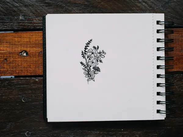 Feldnotizbuch mit Pflanzenskizze